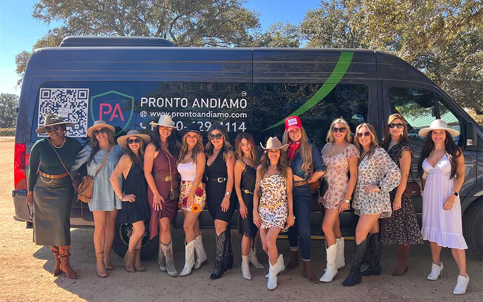 Bachelorette Wine Tours Fredericksburg TX Bachelorette party group enjoying wine tasting on a Fredericksburg TX wine tour with scenic vineyard views and celebratory atmosphere